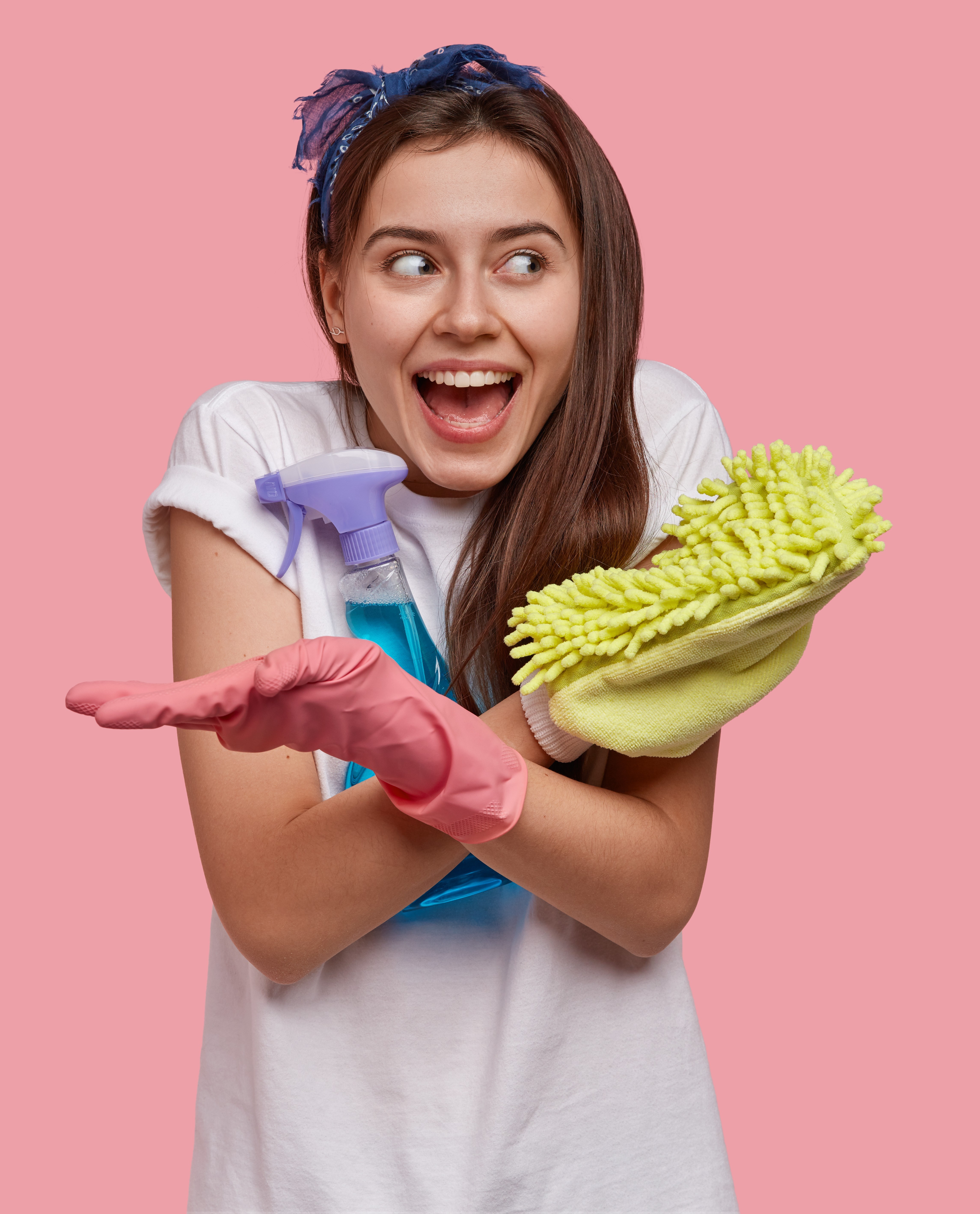 Natural cleaning ingredients including vinegar, baking soda, and lemon on a clean surface